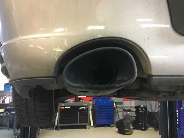 Porsche Bore Scoring Symptom: Sooty 996 Drivers Side Tail Pipe